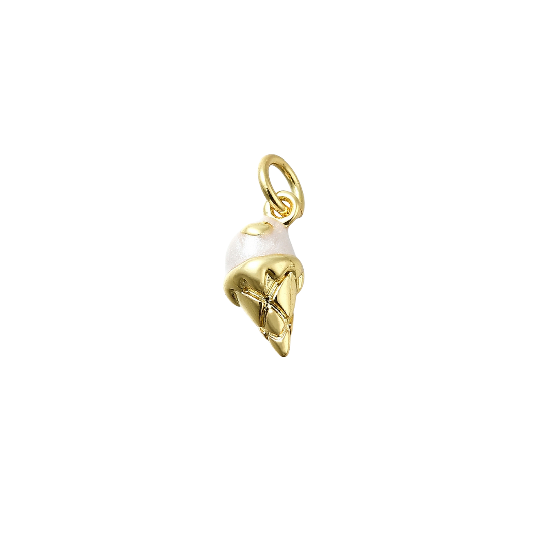 Gold and pearl charm on a white background