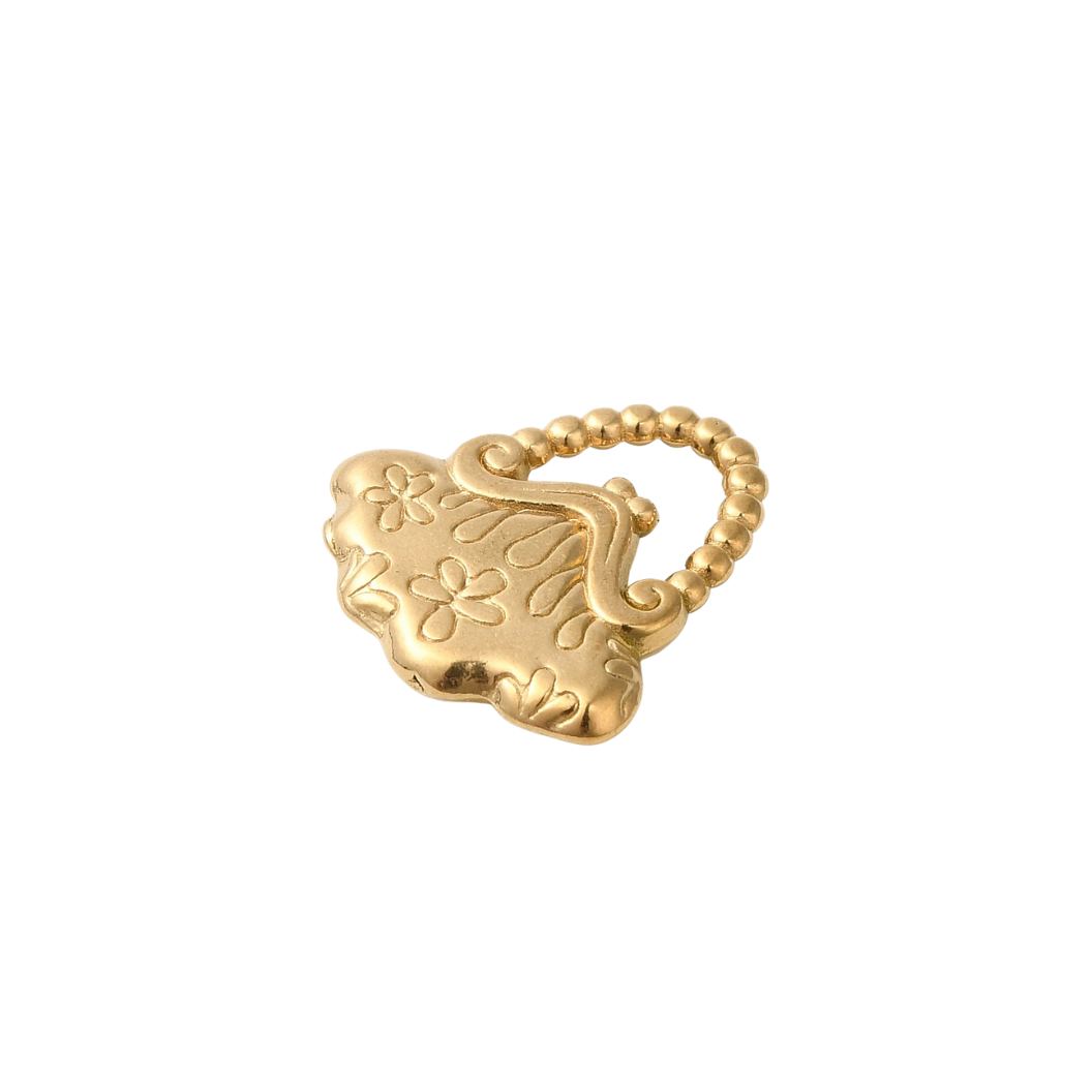 Gold ring with intricate design on a white background