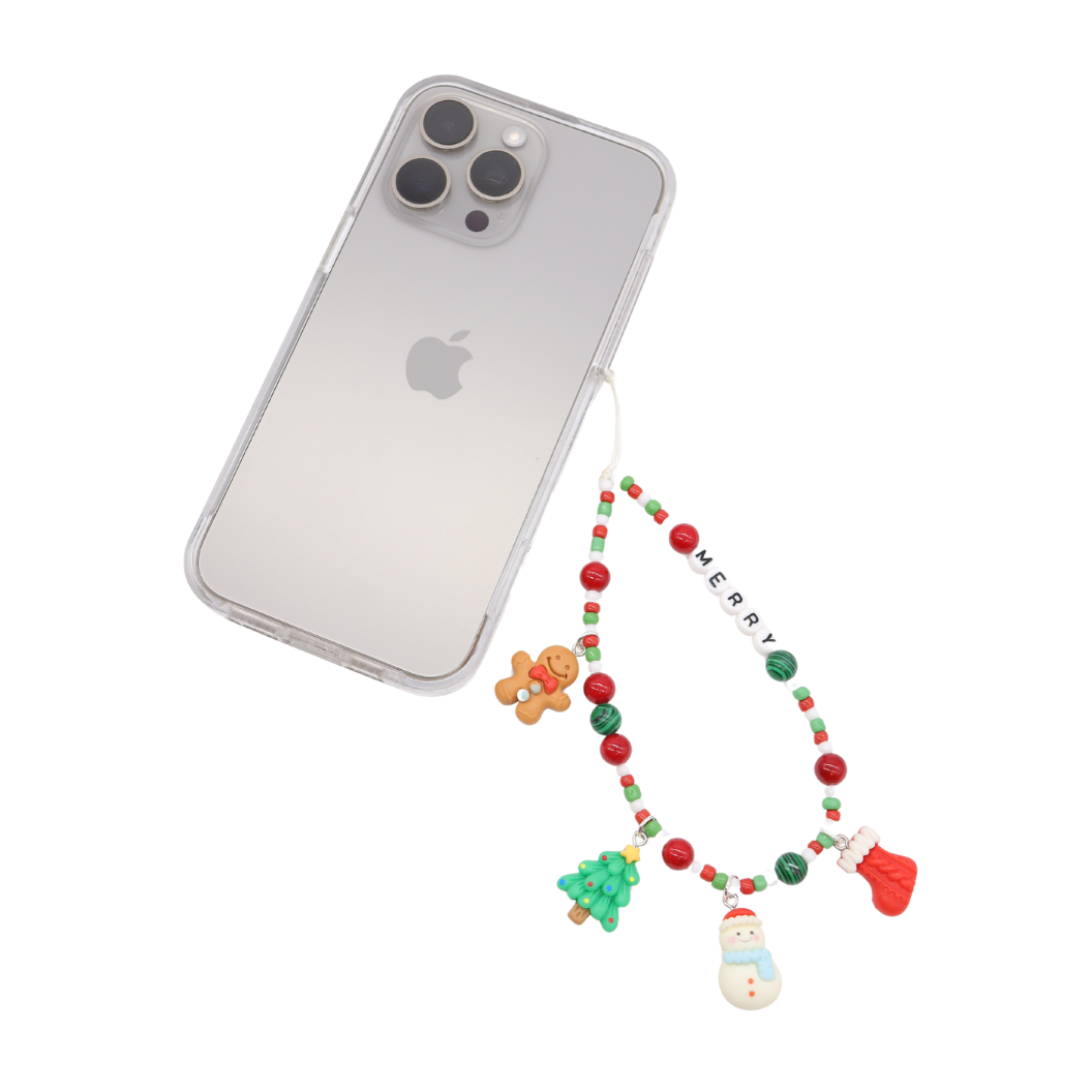 Front of the "Merry" - Beaded Phone Chain attached to a phone with an assortment of charms