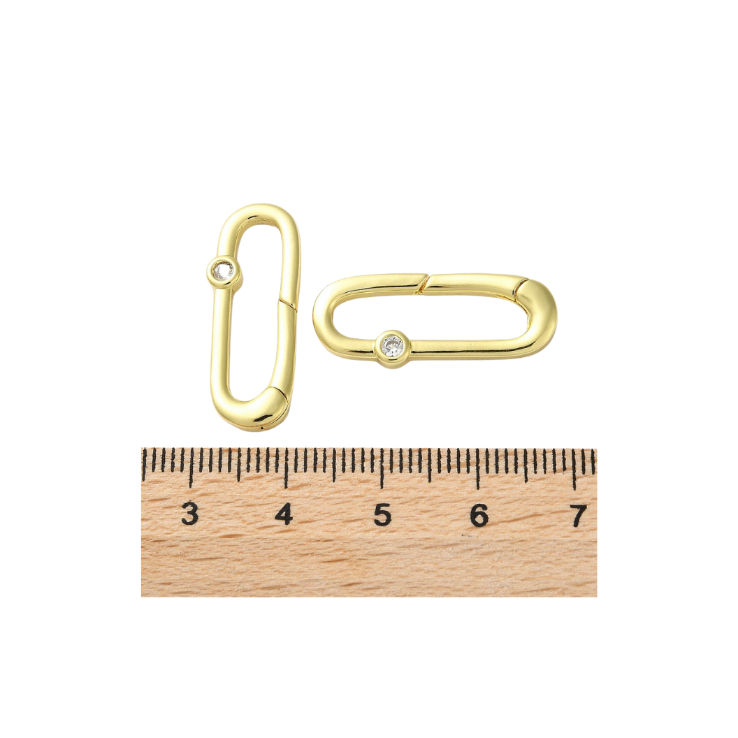Front and side view of the Gold Grace Oval Carabiner compared to a ruler