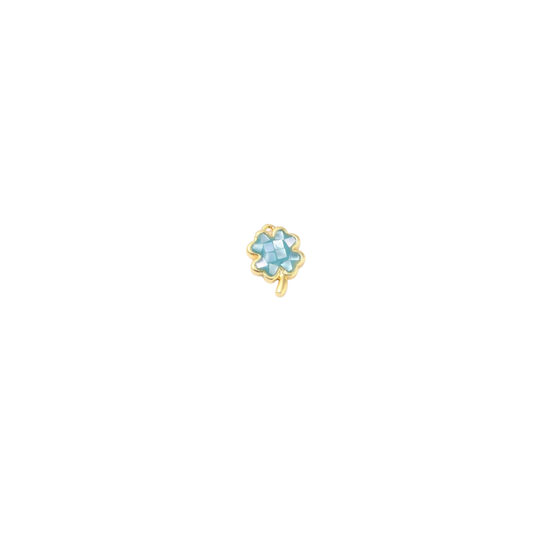 Gold earring with a blue gemstone on a white background