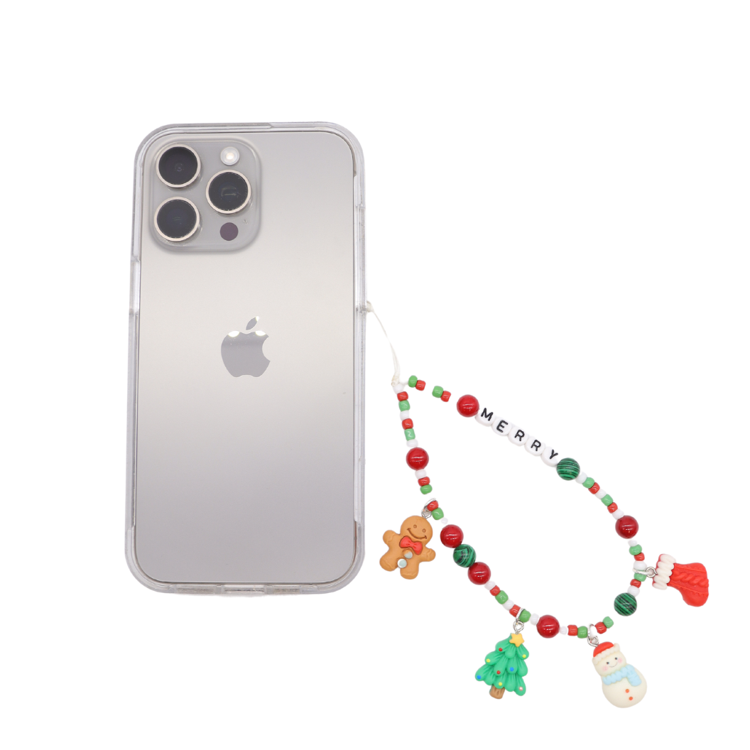 Front of the "Merry" - Beaded Phone Chain attached to a phone with an assortment of charms