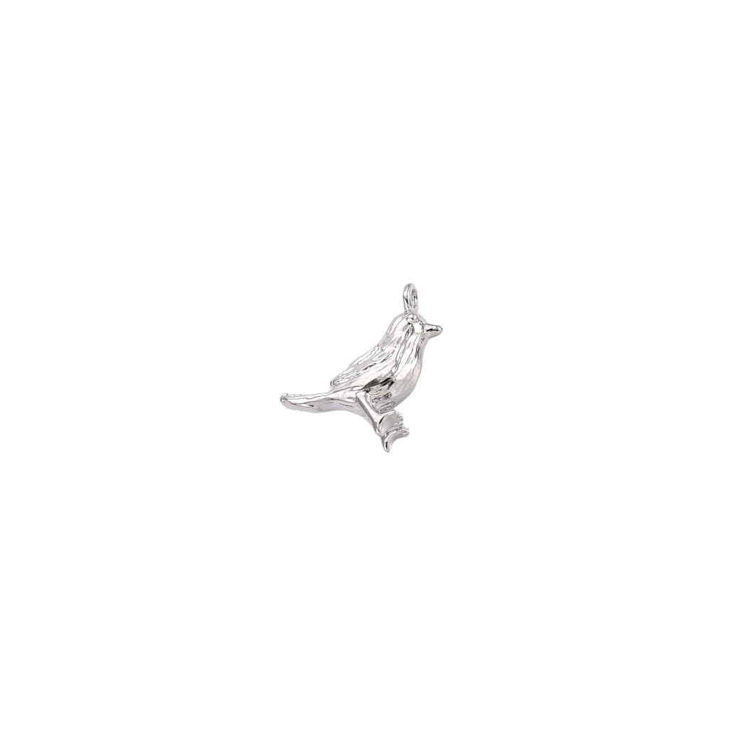 Silver bird-shaped pendant on a white background