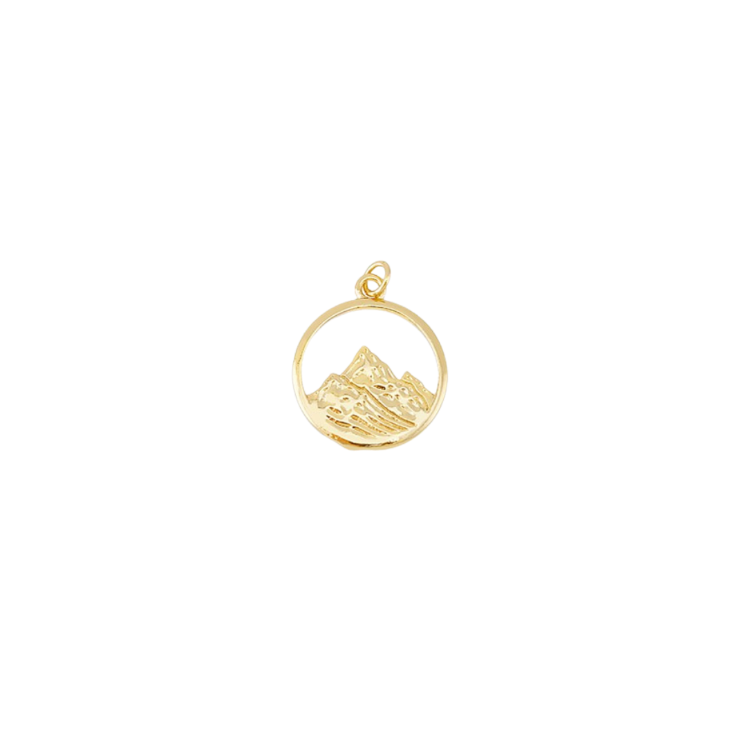 Gold pendant with mountain design on a white background