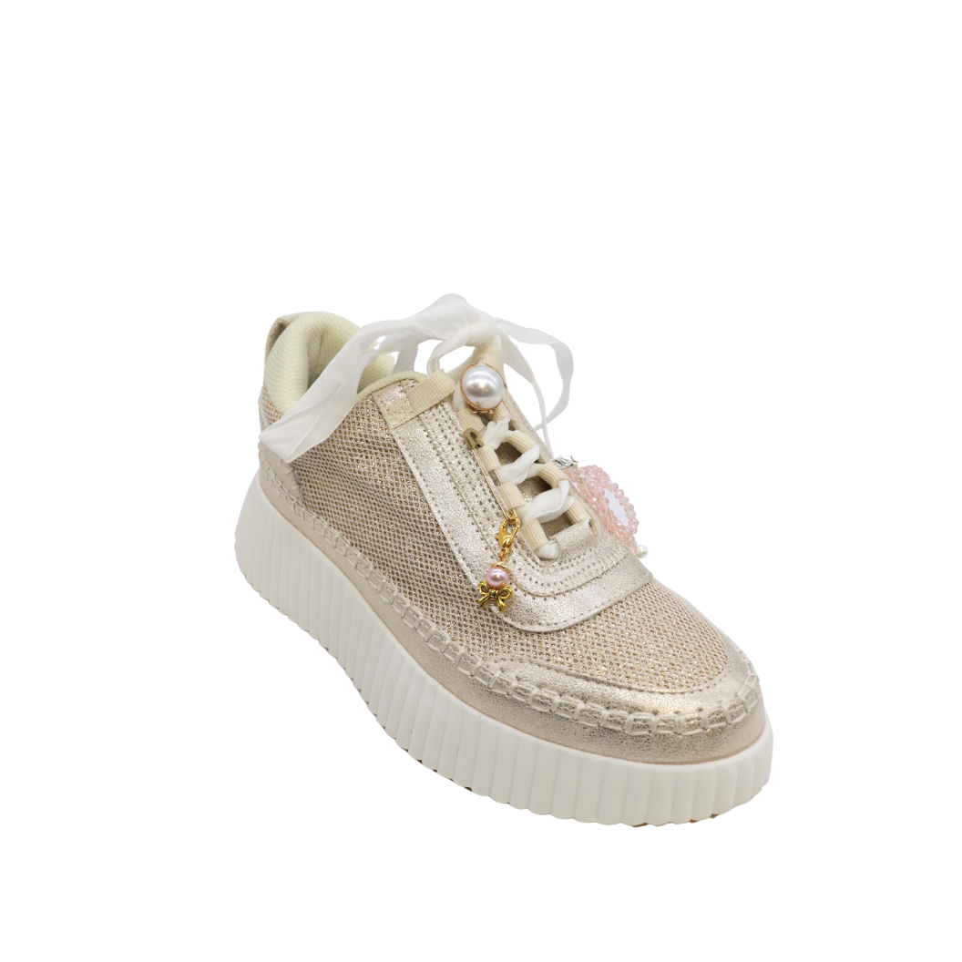 Front of the Gold Assorted Pearl Bow Knot | Shoe, Purse, Hat Charm on a shoe