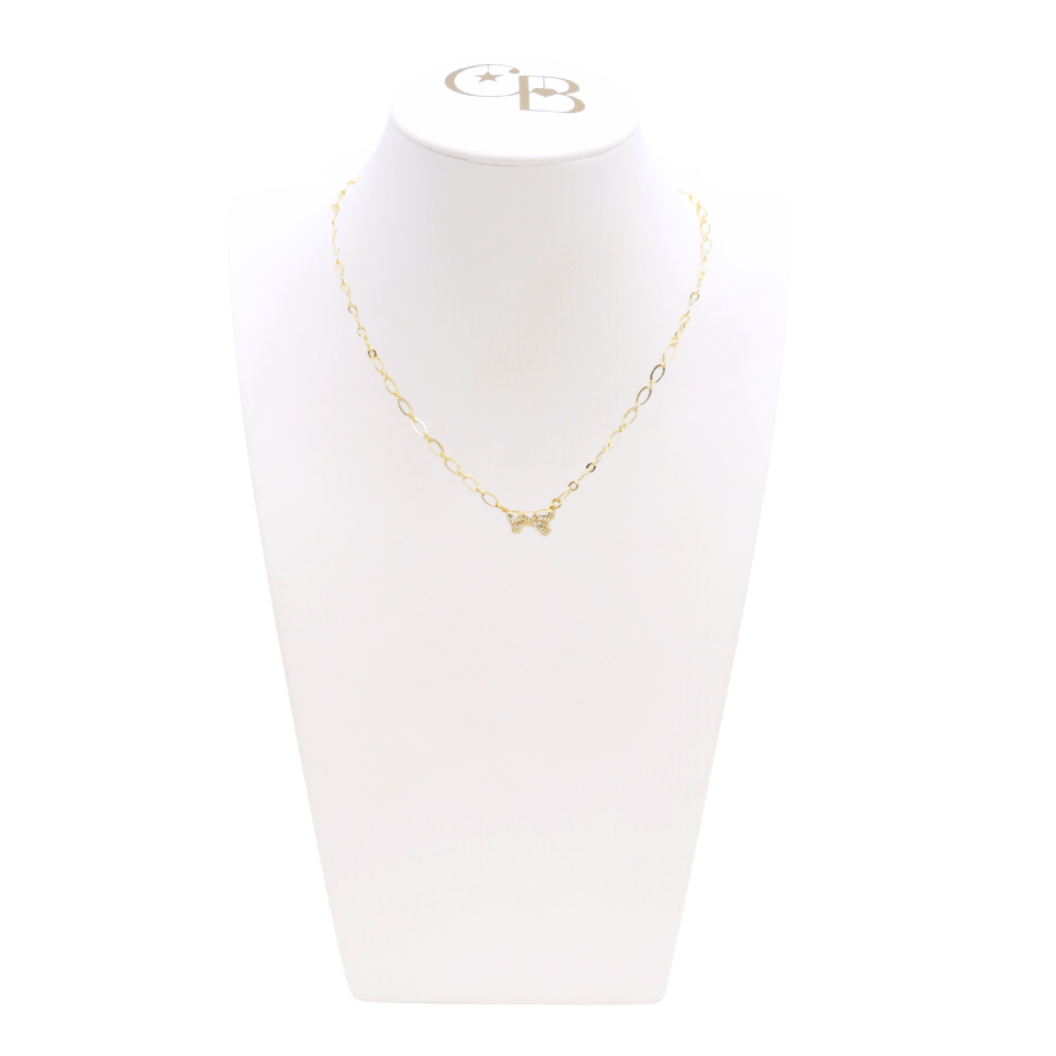Front view of the Gold Dainty Bow Necklace on CB Bust