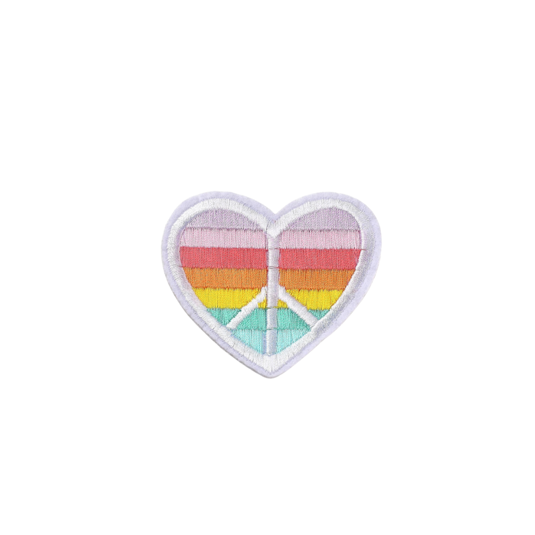 Heart-shaped patch with peace symbol and rainbow colors on a white background