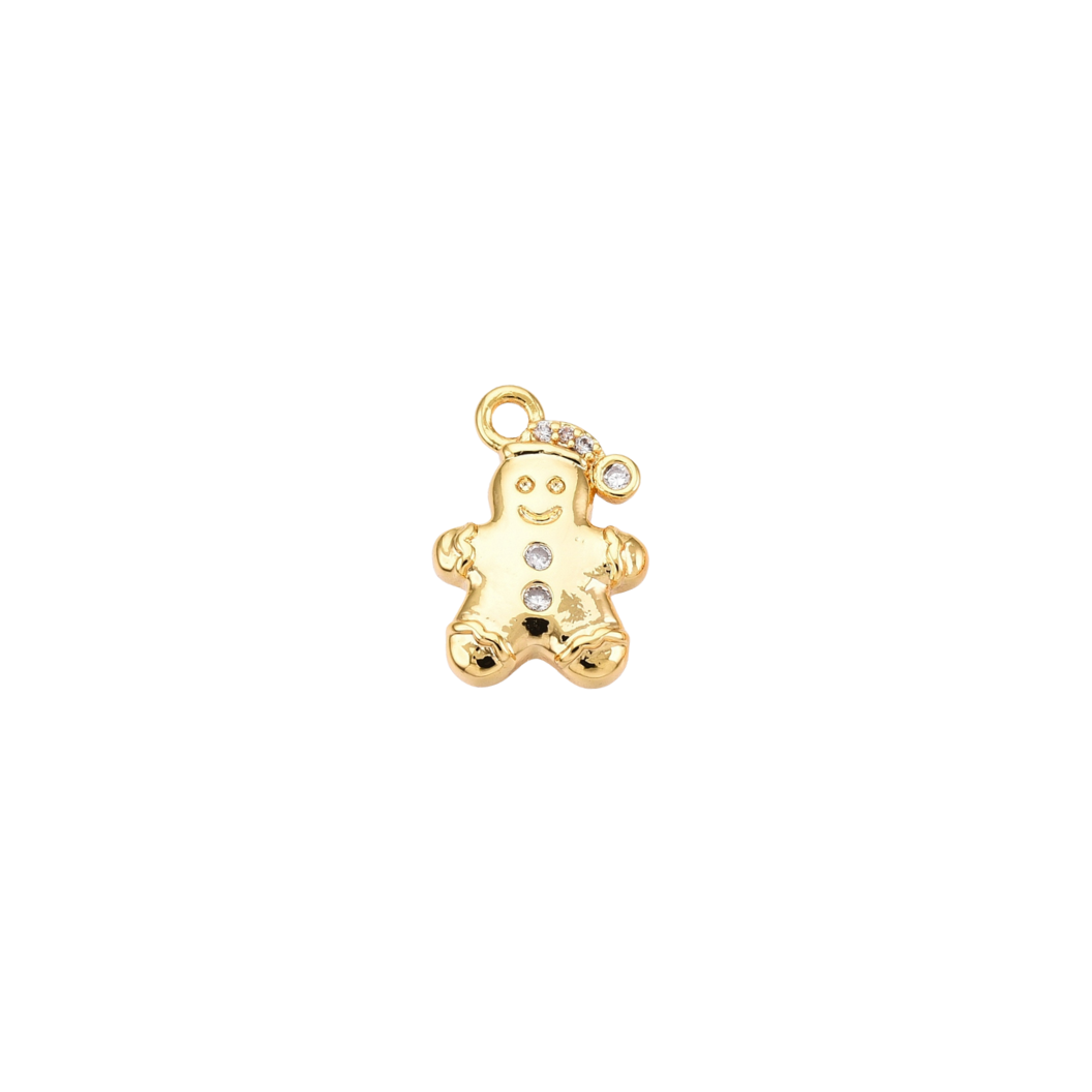 Gold gingerbread man charm with embedded stones on a white background