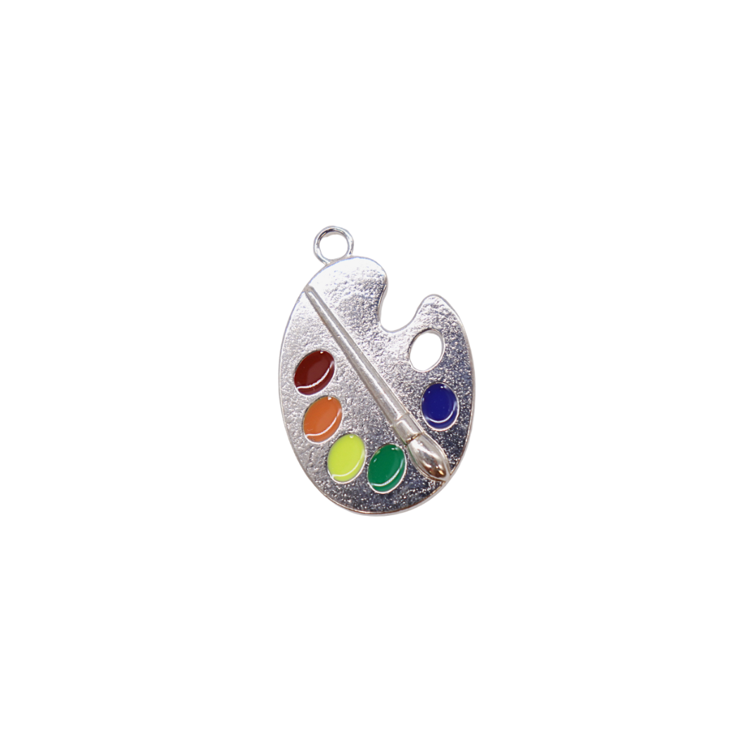 Silver paint palette charm with colorful dots and a paintbrush on a white background