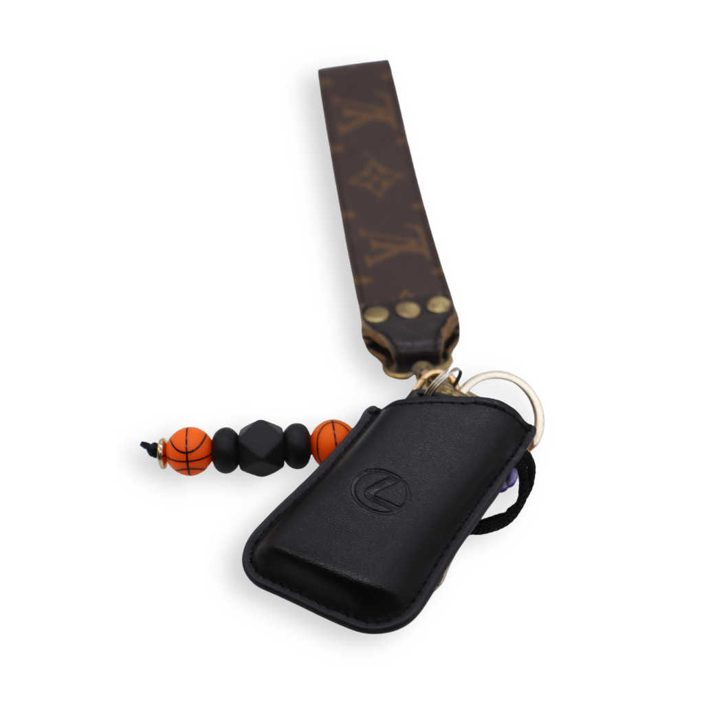 Front of the Black & Orange Basketball Keychain on a set of keys