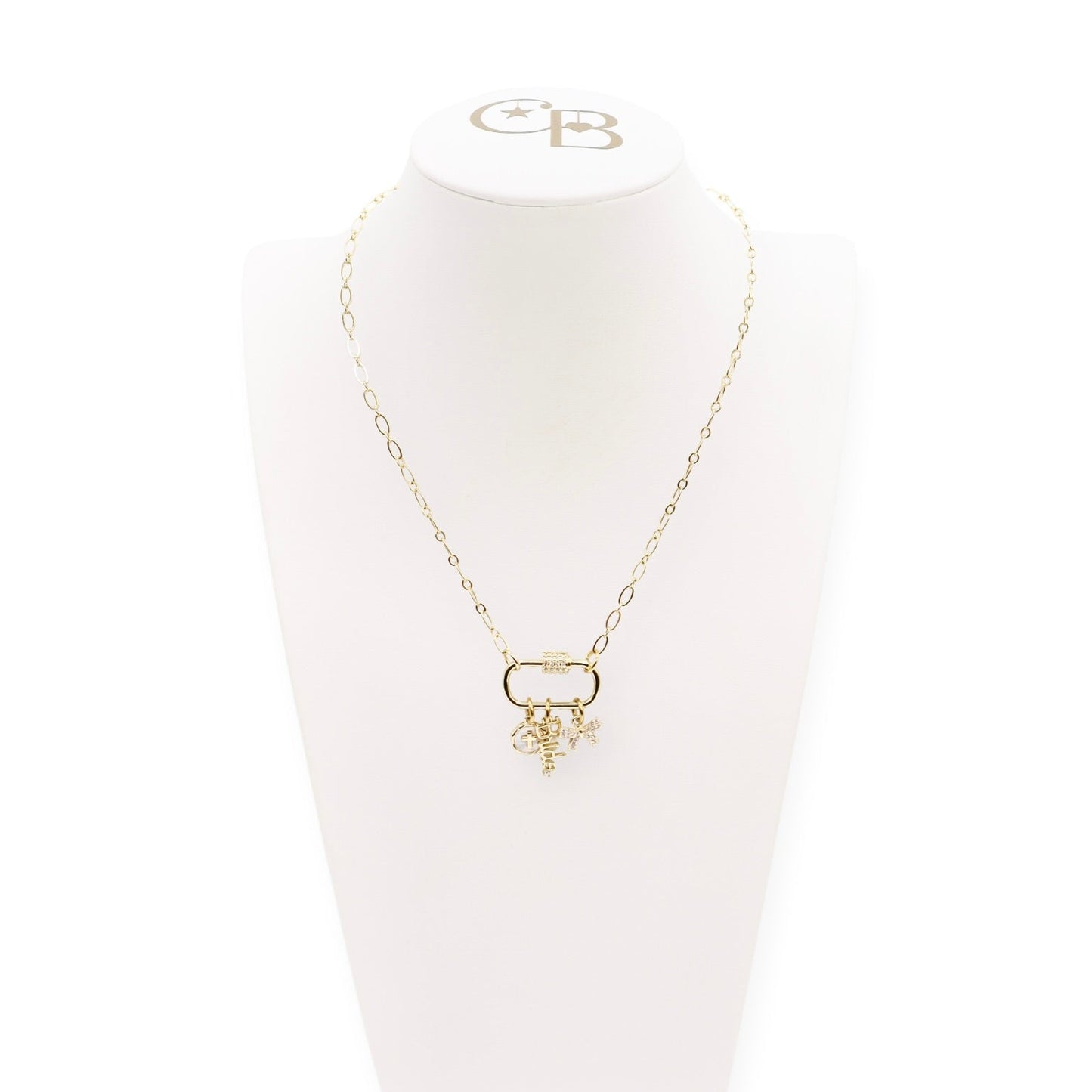 A gold-colored necklace with a central carabiner charm and two additional charms hanging from its length.