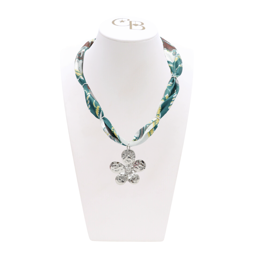 Front view of the Abstract Teal Scarf Necklace with Silver 5 Petal Flower Charm on CB Bust