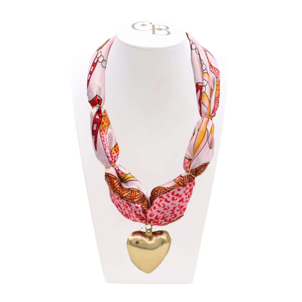 Front view of the Thick Scarf Necklace with Gold Embrace Heart Charm on CB Bust