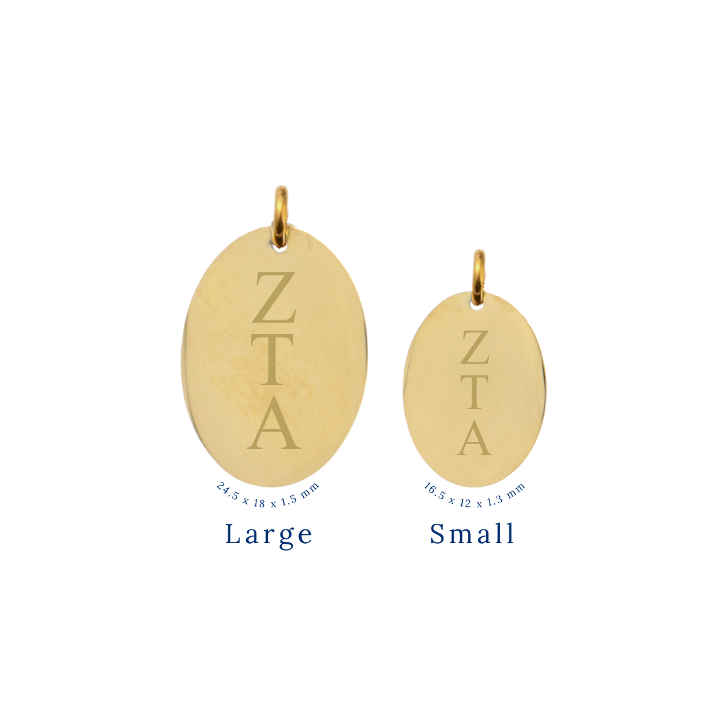 Zeta Tau Alpha gold large oval charm and small oval charm comparison with vertical greek letters front view.