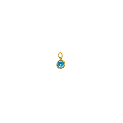 Gold pendant with a blue gemstone on a white background