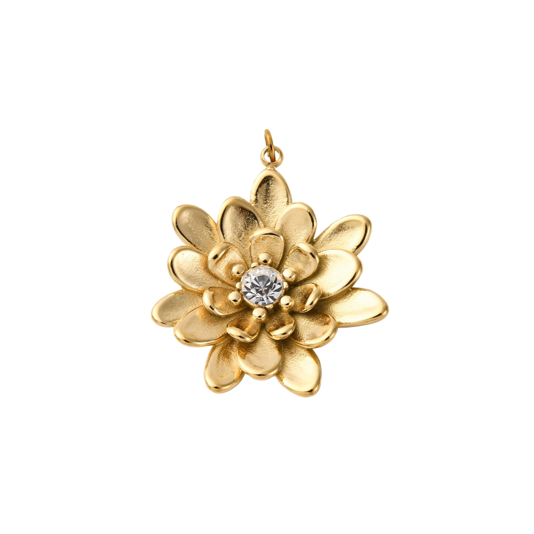 Gold flower-shaped pendant with a central gemstone on a white background