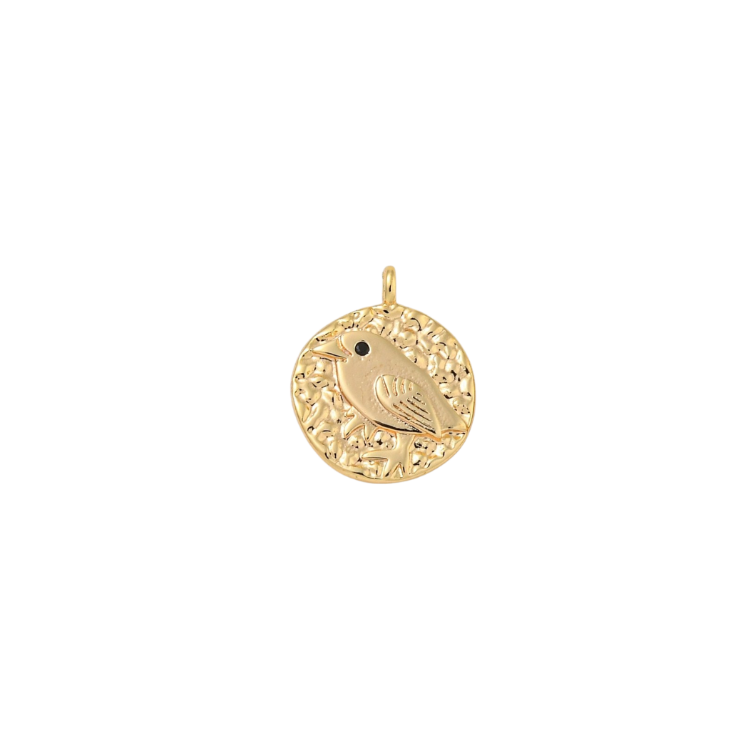 Gold pendant with a bird design on a white background