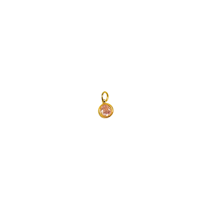 Gold pendant with a pink gemstone on a white background