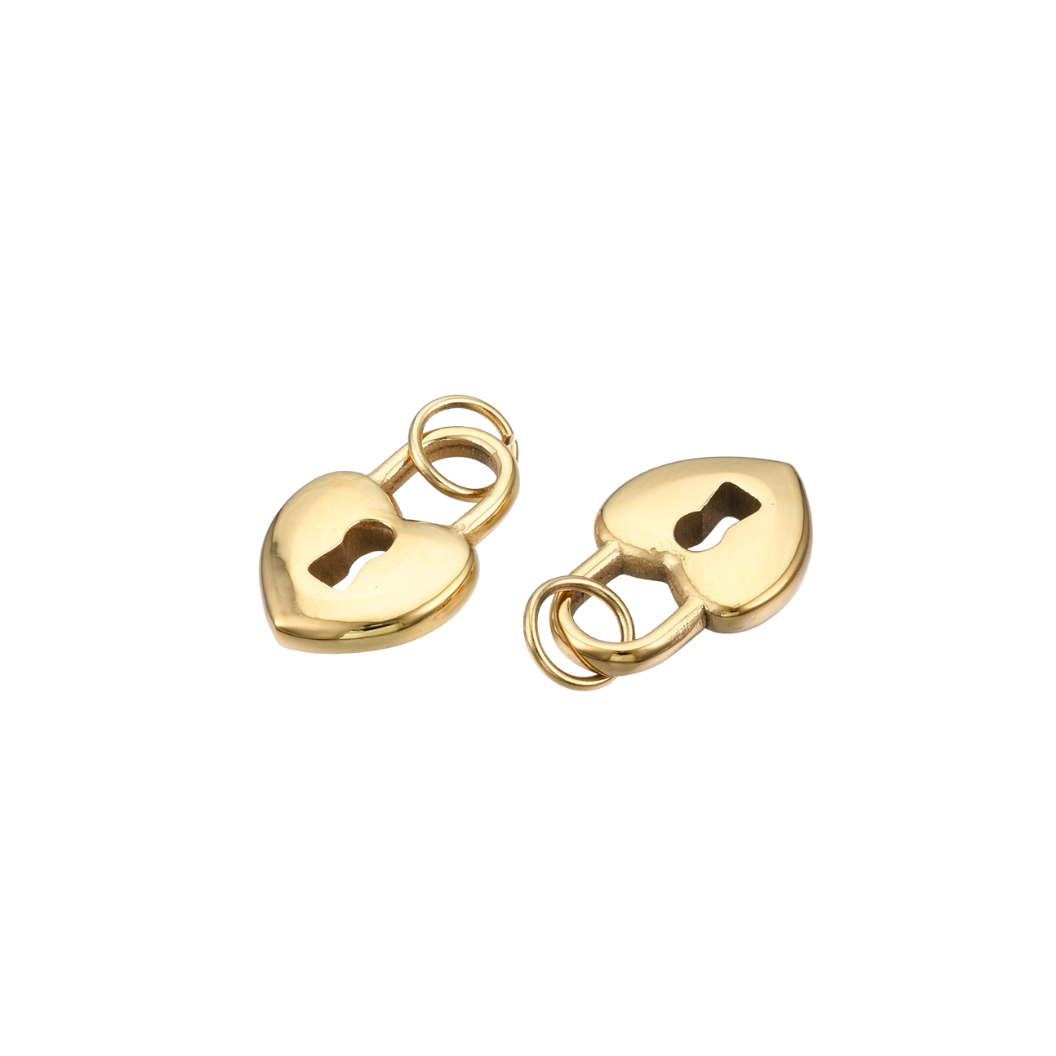 Two gold heart-shaped padlock charms on a white background
