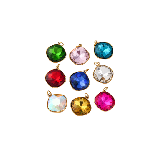 Assorted colorful gemstone pendants on a white background