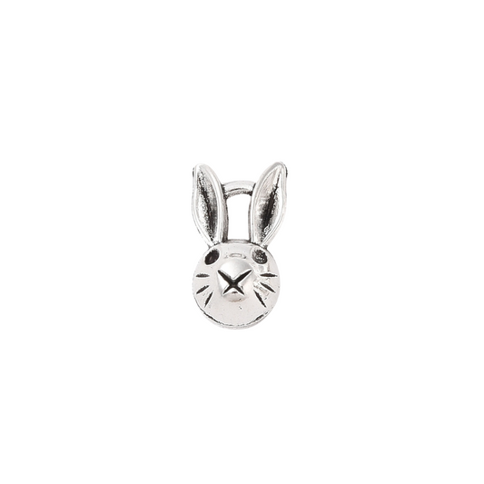 Silver bunny-shaped charm on a white background