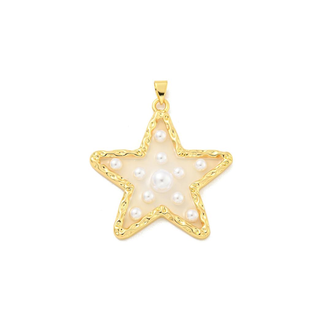 Gold star-shaped pendant with pearls on a white background