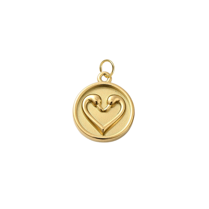 Gold pendant with a heart design on a white background