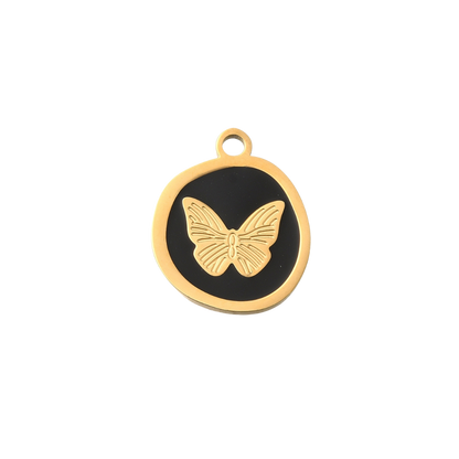Gold butterfly pendant on a black background