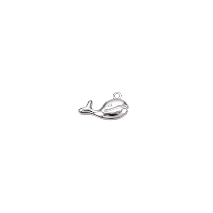 Silver whale pendant on a white background