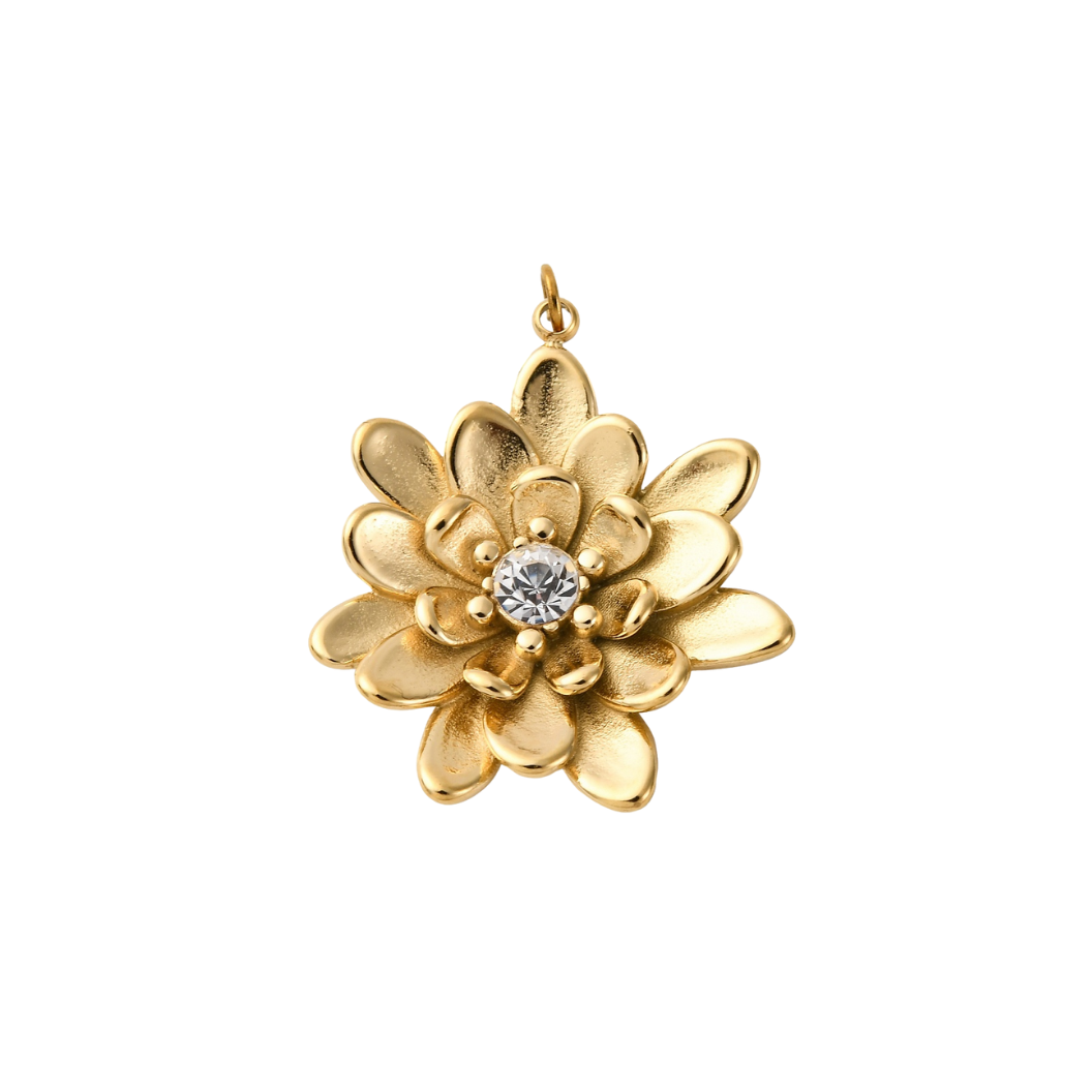 Gold flower-shaped pendant with a central gemstone on a white background