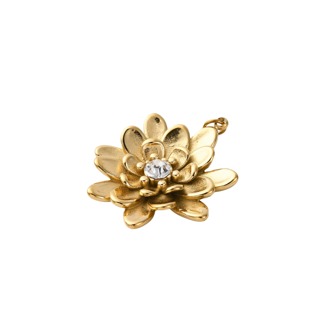 Gold lotus flower pendant with a clear gemstone on a white background