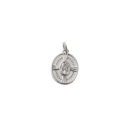 Silver pendant with a central gemstone on a white background