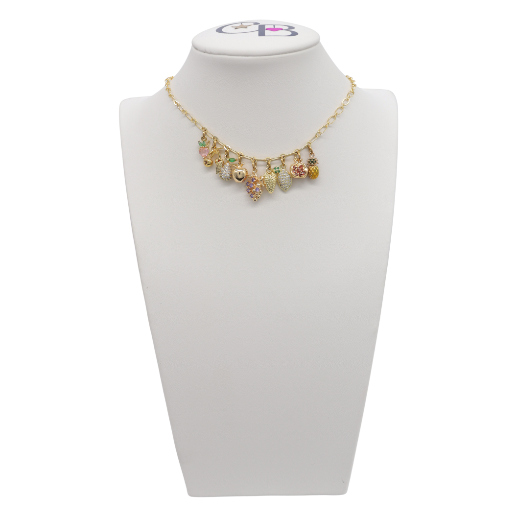 Necklace with colorful charms on a white mannequin bust