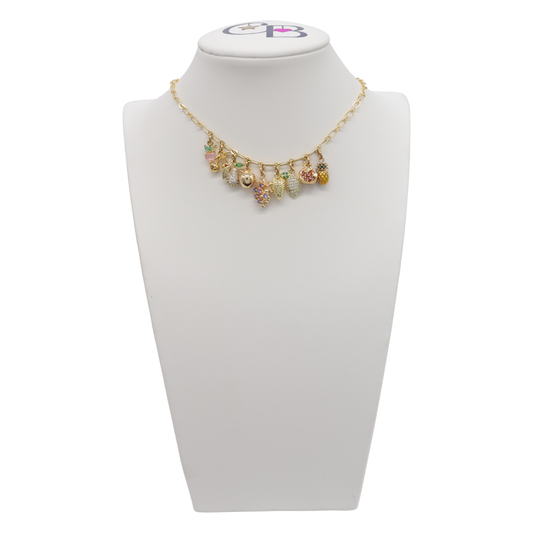 Necklace with colorful charms on a white mannequin bust