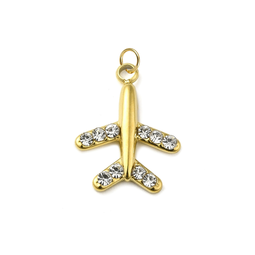 Gold airplane-shaped pendant with clear stones on a white background