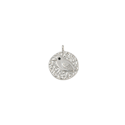 Silver pendant with intricate design on a white background