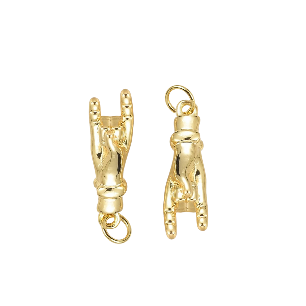 Gold hand-shaped charms on a white background