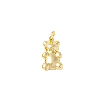 Gold teddy bear pendant on a white background