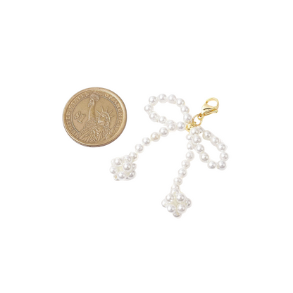 Pearl Bow | Shoe & Purse Charm compared to a coin