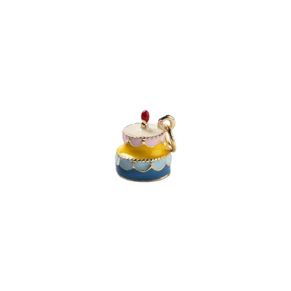 Colorful cake-shaped charm on a white background
