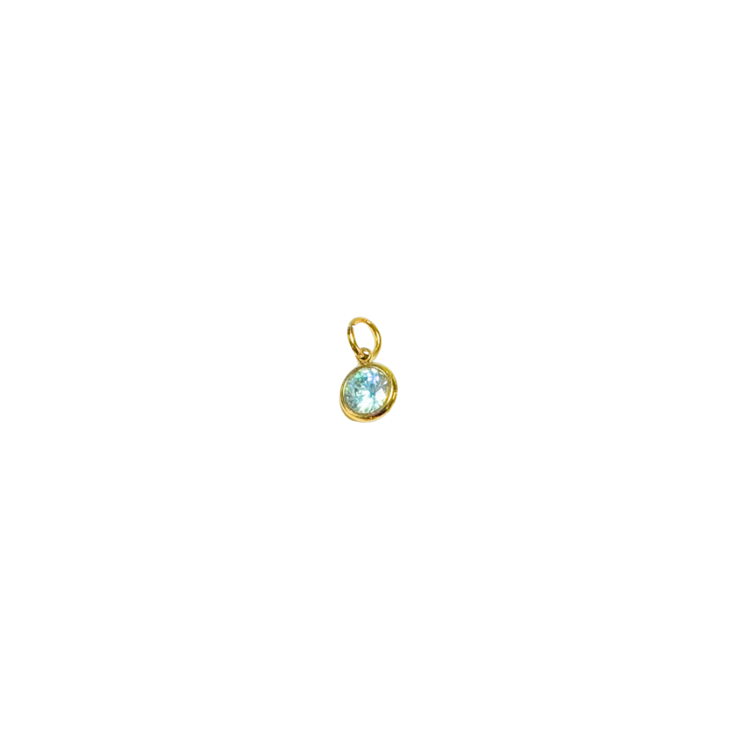 Gold pendant with a blue gemstone on a white background