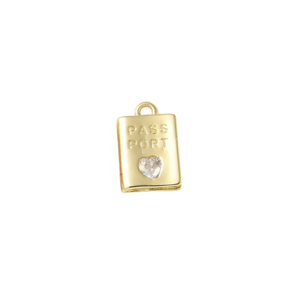Gold charm shaped like a passport with a heart on a white background