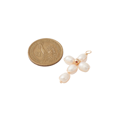 Gold Pearl Pendant Cross Charm compared to a coin
