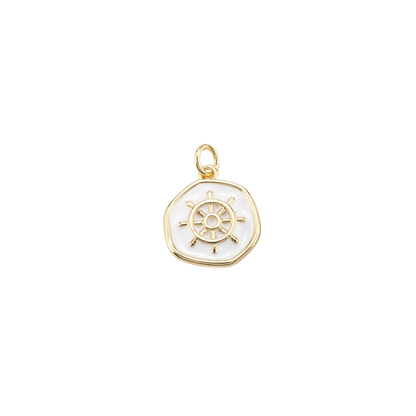 Gold pendant with a ship's wheel design on a white background