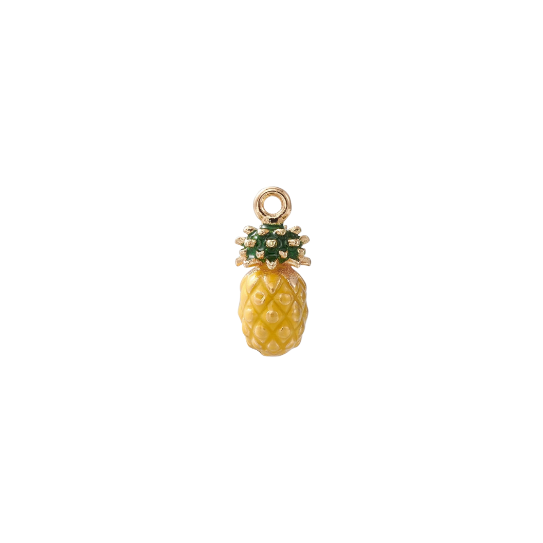 Gold pineapple charm on a white background