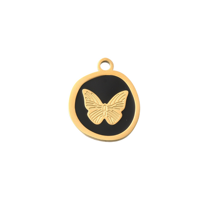 Gold butterfly pendant on a black background