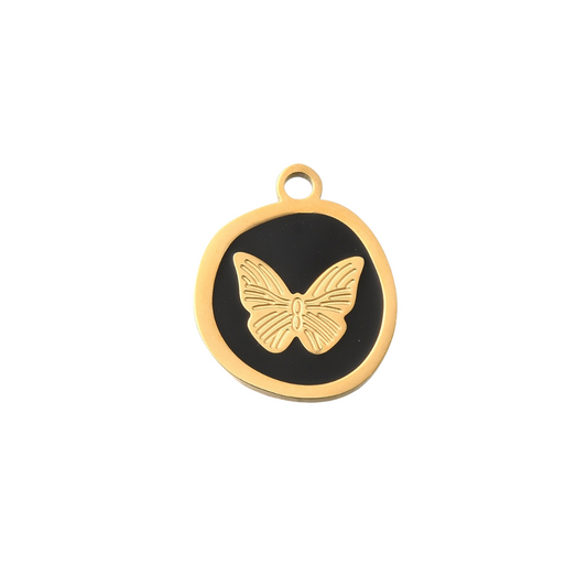 Gold butterfly pendant on a black background