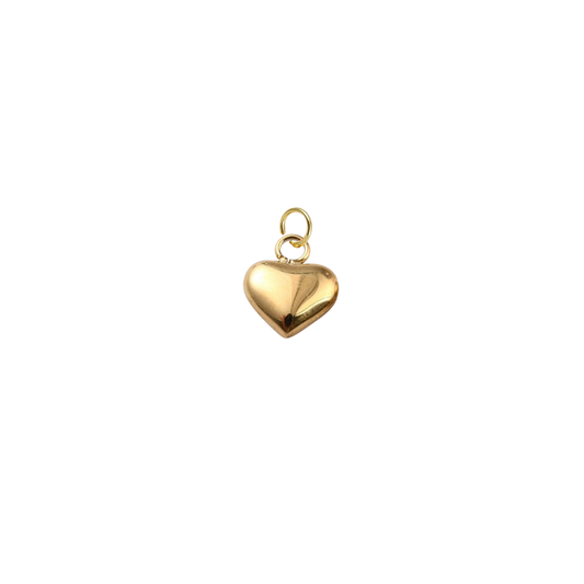 Gold heart-shaped pendant on a white background