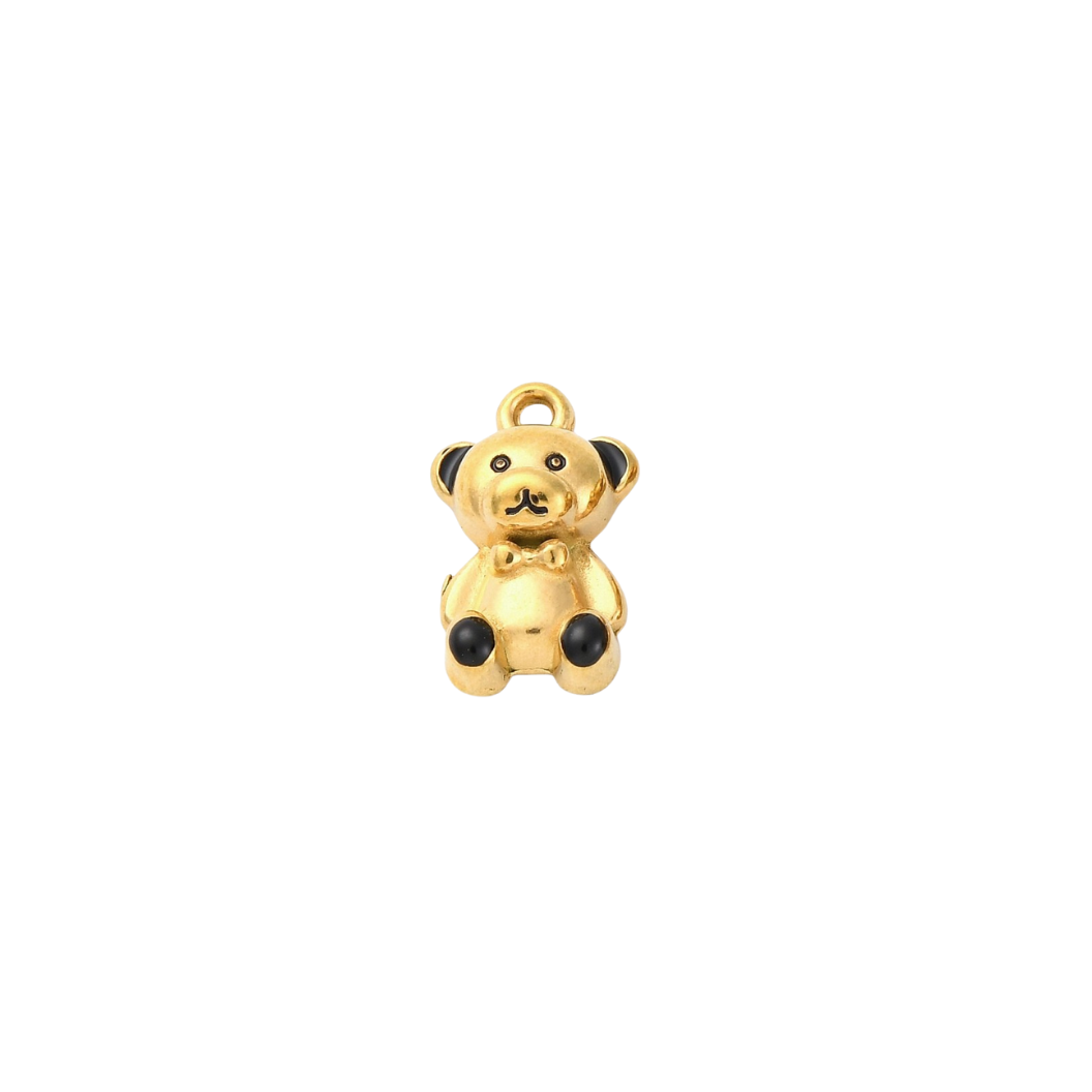 Gold teddy bear charm on a white background