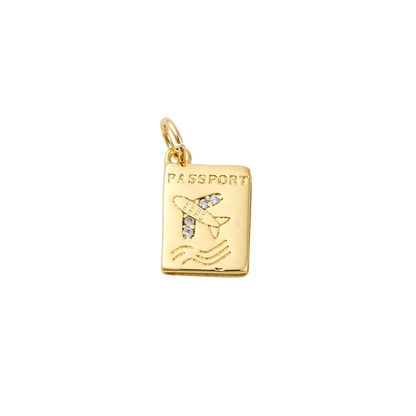 Gold pendant shaped like a passport with an airplane on a white background